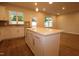 Updated kitchen features granite countertops, stainless appliances, tile backsplash and wood floors at 912 Montague Ave, Durham, NC 27703