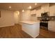 Kitchen features granite countertops, stainless appliances, tile backsplash, and wood flooring at 912 Montague Ave, Durham, NC 27703