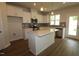 New kitchen features granite countertops, stainless appliances, and new wood flooring at 912 Montague Ave, Durham, NC 27703