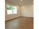 Living Room features wood flooring, recessed lighting, and a large window at 912 Montague Ave, Durham, NC 27703