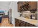 Stylish bar area featuring a wine rack, glass storage, and counter space near the kitchen at 940 Rivers Edge Dr, Graham, NC 27253