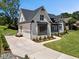 Beautiful house with a concrete driveway, landscaped yard and painted brick exterior at 940 Rivers Edge Dr, Graham, NC 27253