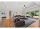 Spacious living room with hardwood floors, a large sectional sofa and natural light at 940 Rivers Edge Dr, Graham, NC 27253