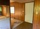 Entry way featuring wood paneled walls and view to the living room at , Cameron, NC 28326