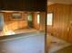 The living room has wood paneling, and the room is adjacent to the kitchen at , Cameron, NC 28326
