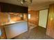 The living room has wood paneling, and the room is adjacent to the kitchen and entryway at , Cameron, NC 28326
