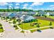 Aerial view of home showing manicured lawn and landscaping, set in a picturesque neighborhood at 1004 Sounding Ln, Durham, NC 27703