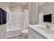 Clean bathroom with tub, shower, and sleek white vanity at 1004 Sounding Ln, Durham, NC 27703