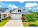 Charming single-story home with a two-car garage, a landscaped front yard, and a welcoming entrance at 1004 Sounding Ln, Durham, NC 27703