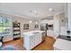 Spacious kitchen featuring a large island, stainless steel appliances, and hardwood floors at 1004 Sounding Ln, Durham, NC 27703