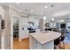 Modern kitchen with white cabinets, stainless steel appliances, and an open pantry at 1004 Sounding Ln, Durham, NC 27703