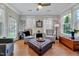 Inviting living room with hardwood floors, a ceiling fan, and plenty of natural light at 1004 Sounding Ln, Durham, NC 27703