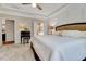 Spacious main bedroom with a decorative tray ceiling and ensuite bathroom at 1004 Sounding Ln, Durham, NC 27703