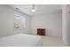 Bright bedroom with neutral carpet, a dresser, and a large window for ample natural light at 108-203 Northbrook Dr # 203, Raleigh, NC 27609
