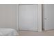 A bedroom with a closet, an open doorway and neutral color scheme and carpet at 108-203 Northbrook Dr # 203, Raleigh, NC 27609