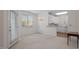 Open concept dining room with natural light and access to the kitchen and outdoor area at 108-203 Northbrook Dr # 203, Raleigh, NC 27609