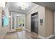 Lobby area with elevator, natural lighting and bench seating, providing an inviting welcome at 108-203 Northbrook Dr # 203, Raleigh, NC 27609