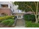 Building entrance with stairs and lush landscaping, creating a welcoming and attractive approach at 108-203 Northbrook Dr # 203, Raleigh, NC 27609