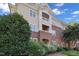Beautiful multi-level exterior showcasing brick and siding details, complemented by mature landscaping at 108-203 Northbrook Dr # 203, Raleigh, NC 27609
