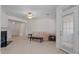 Bright living room featuring a fireplace, neutral carpeting, and an outdoor access door at 108-203 Northbrook Dr # 203, Raleigh, NC 27609