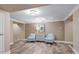 Bright lobby area with wood-look floors, elegant decor, and comfortable seating for residents and guests at 108-203 Northbrook Dr # 203, Raleigh, NC 27609