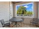 Cozy covered porch with table and chairs, perfect for outdoor dining and relaxation at 108-203 Northbrook Dr # 203, Raleigh, NC 27609