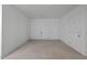 Storage area with multiple numbered white doors and concrete floor at 108-203 Northbrook Dr # 203, Raleigh, NC 27609