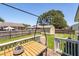 Backyard featuring a well-maintained lawn, a deck with outdoor seating, and a storage shed at 117 James Dr, Pine Level, NC 27568