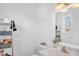 Bathroom with shelves, vanity, sink and a large mirror at 117 James Dr, Pine Level, NC 27568