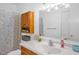Bathroom featuring a wooden vanity, cabinet, and a colorful shower curtain at 117 James Dr, Pine Level, NC 27568
