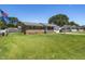 A charming brick home with a well-manicured lawn and an American flag waving, showcasing classic curb appeal at 117 James Dr, Pine Level, NC 27568