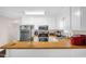 Bright kitchen features white cabinets, butcher block counters and stainless steel appliances at 117 James Dr, Pine Level, NC 27568
