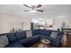 Open-concept living area flowing into a well-lit kitchen with white cabinets and modern appliances at 117 James Dr, Pine Level, NC 27568