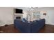 Comfortable living room with hardwood floors, a brick fireplace, and a large sectional sofa for relaxing at 117 James Dr, Pine Level, NC 27568