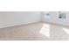 Well-lit bedroom features carpet, neutral paint, and a view of the outdoors at 119 Leven Dr, Gibsonville, NC 27249