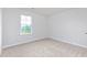 Cozy bedroom with plush carpet and a bright window offering natural light at 119 Leven Dr, Gibsonville, NC 27249