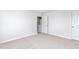 Bright bedroom with carpet, neutral paint, and ensuite bathroom and closets at 119 Leven Dr, Gibsonville, NC 27249
