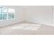 Sunlit bedroom featuring a large window that offers plenty of natural light at 119 Leven Dr, Gibsonville, NC 27249