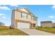Two-story home features a brick and vinyl exterior with an attached garage and a long concrete driveway at 119 Leven Dr, Gibsonville, NC 27249