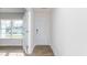 Bright foyer with a white door, wood-look floors, and an adjacent room with large windows at 119 Leven Dr, Gibsonville, NC 27249