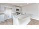 Bright kitchen features an island, granite countertops, stainless appliances, and stylish gray cabinets at 119 Leven Dr, Gibsonville, NC 27249