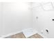 Functional laundry room with hookups and overhead shelving, ready for customization at 119 Leven Dr, Gibsonville, NC 27249