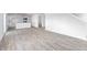 Open-concept living and kitchen area with vinyl floors, great for entertaining and daily living at 119 Leven Dr, Gibsonville, NC 27249