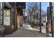 An urban street view with storefronts, sidewalks, a utility pole, and on street parking at 1246 Coach Station Aly # 101, Raleigh, NC 27601