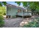 Well-maintained backyard with a deck and a glimpse of the home's exterior at 125 Chimney Rise Dr, Cary, NC 27511