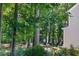 Wooded backyard with lawn furniture near the lake at 125 Chimney Rise Dr, Cary, NC 27511