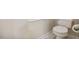 Neutral bathroom featuring a toilet and grab bar for assistance at 125 Chimney Rise Dr, Cary, NC 27511