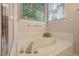 Bathroom featuring a soaking tub, and a window with natural light at 125 Chimney Rise Dr, Cary, NC 27511