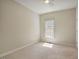 Neutral bedroom with natural light, carpeted floors, and ceiling fan at 125 Chimney Rise Dr, Cary, NC 27511