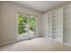 Bedroom featuring a window with a view and built-in shelves at 125 Chimney Rise Dr, Cary, NC 27511